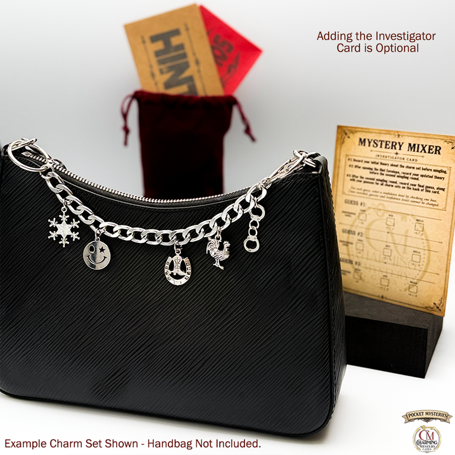 Black handbag with silver charms on a white background, surrounded by game cards and a pouch.