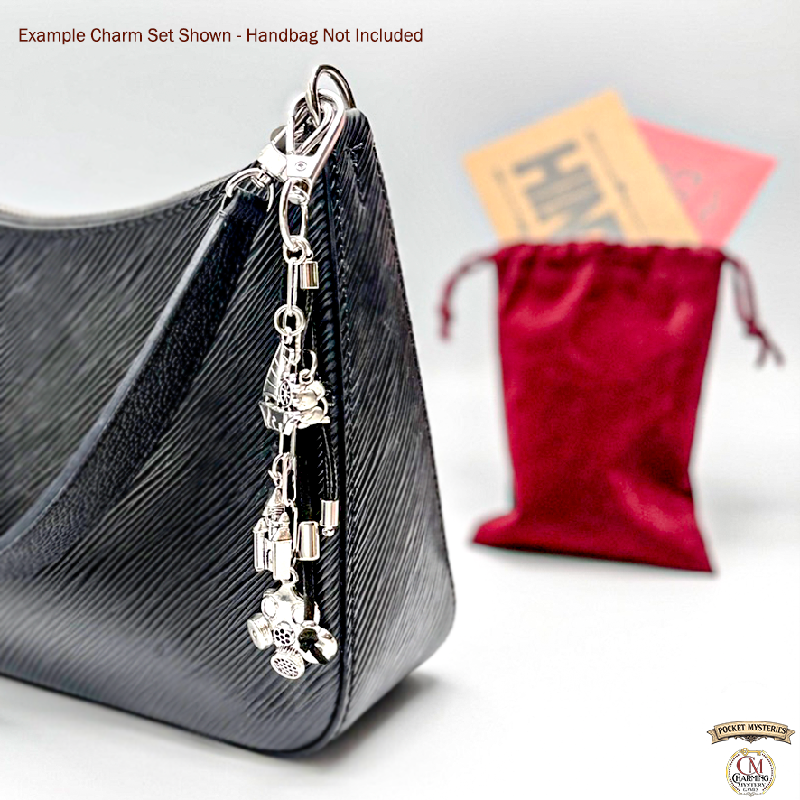 Silver charm set on a handbag with a red pouch in the background