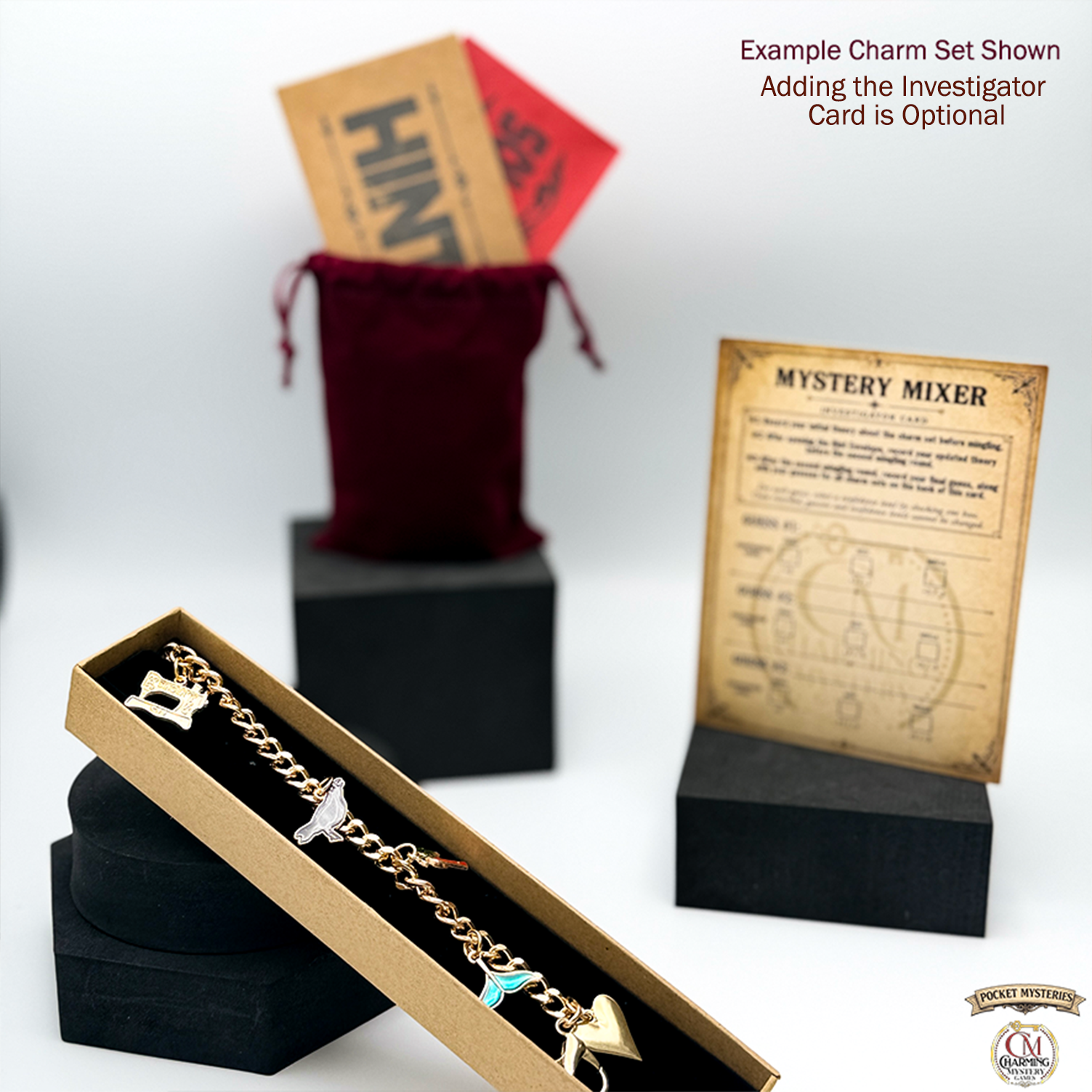 Gold charm set in a box with 'Mystery Mixer' card and red bag in the background