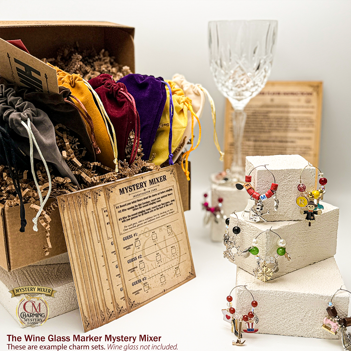 The Mystery Mixer kit in the box with the investigator cards, the pouches, and the wine charm sets 