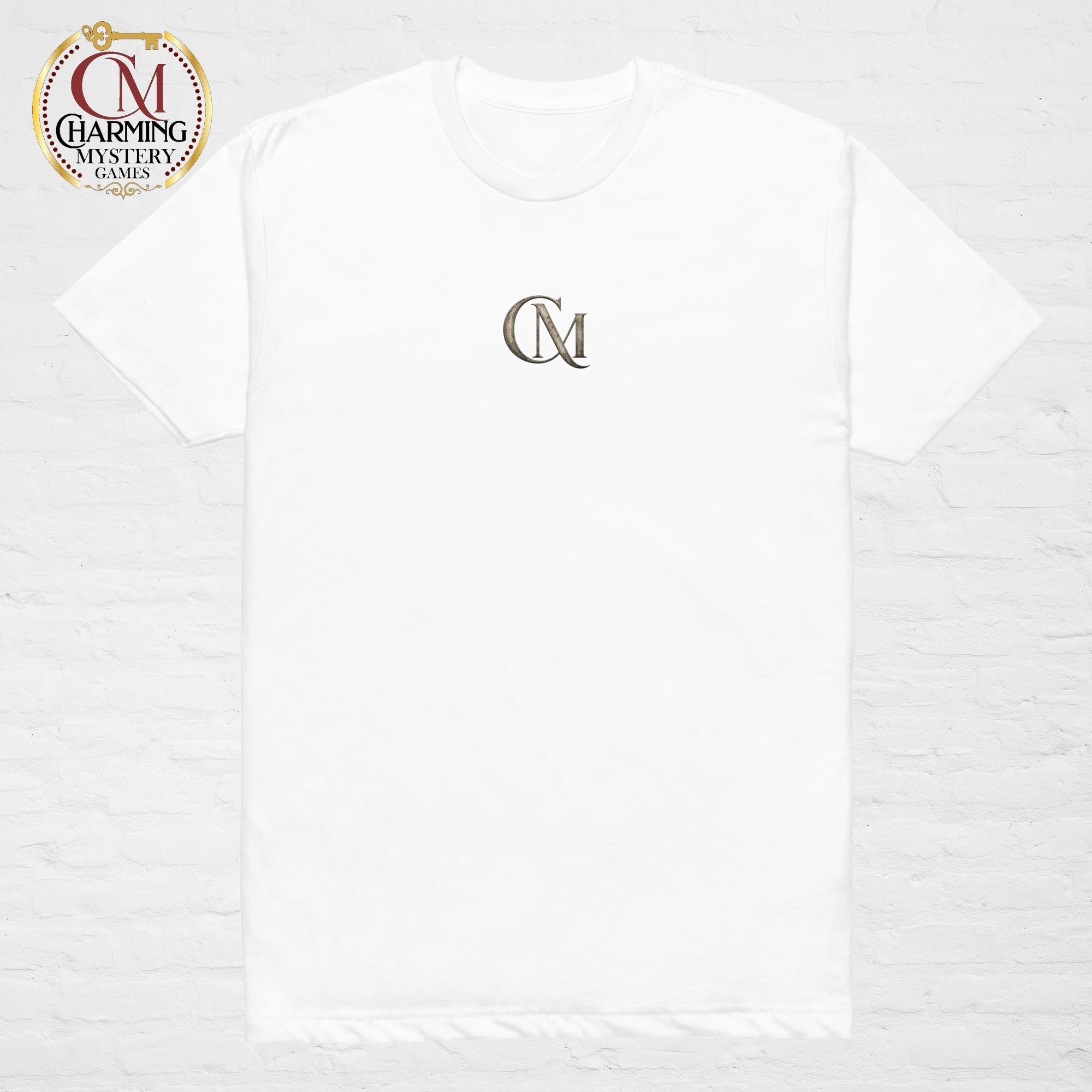 Product mockup of a white tee shirt that has a CM logo on it for Charming Mystery Games. 